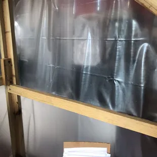 The workers and customers are separated by visqueen.