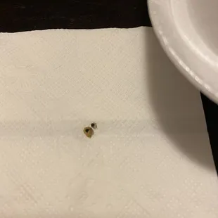 a piece of toilet paper with a hole in it