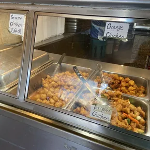 a display case with a variety of food items