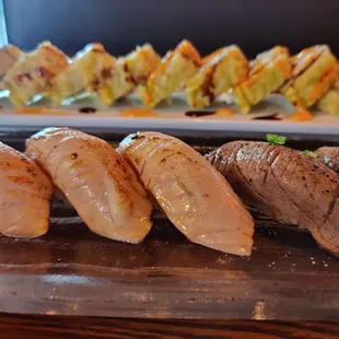 Seared salmon + Seared tuna (front) and Jumbo Cali roll (back)