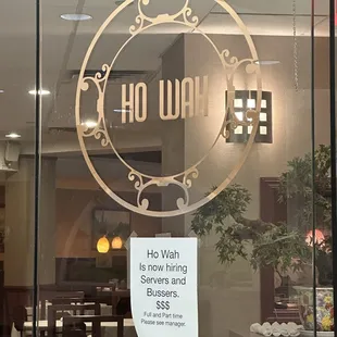 a sign in the window of a restaurant