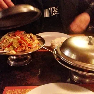 entrees (lo mein shown) in cute tower dishes.