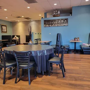 a dining room with a table and chairs