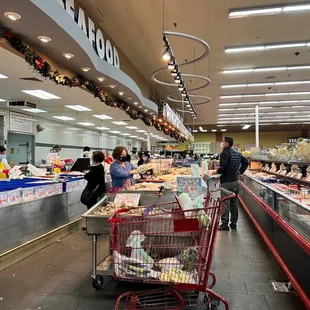 people shopping in a grocery store