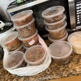 a variety of food in plastic containers