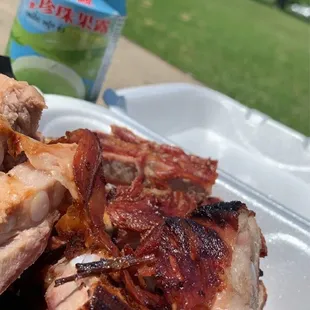 a plate of ribs and a can of beer
