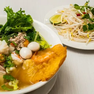 a bowl of soup and a plate of salad