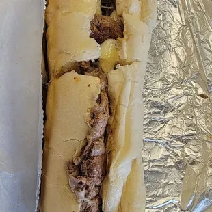 Large steak sandwich, just cheese and onions. Delicious!