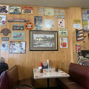The booths are comfy and the walls are covered.