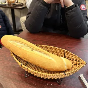 a long loaf of bread in a basket