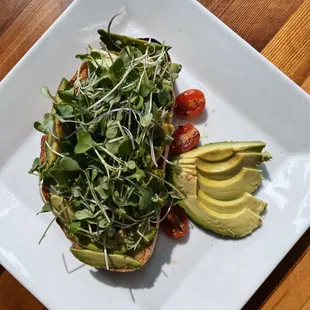 #1 Avocado Toast ( Avocado, micro greens, and truffle oil)