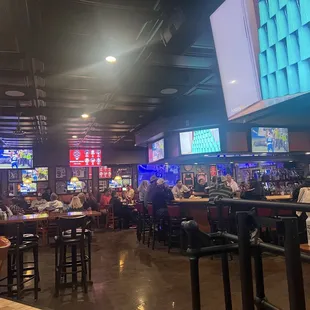 Inside area, lots of TVs