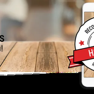 a phone on a wooden table