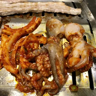 a variety of meats on a grill