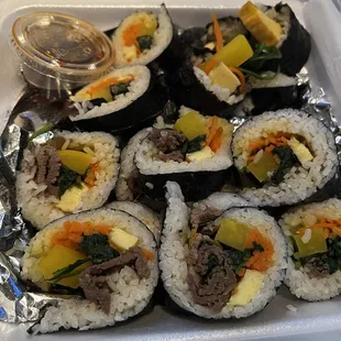 a tray of sushi rolls