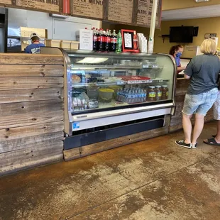a woman standing at the counter