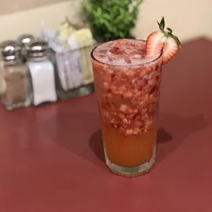 a glass of strawberry juice
