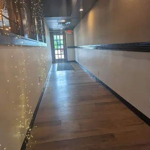 a long hallway with lights