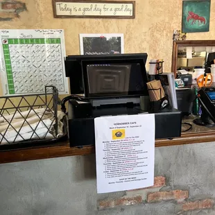 a counter with a sign on it