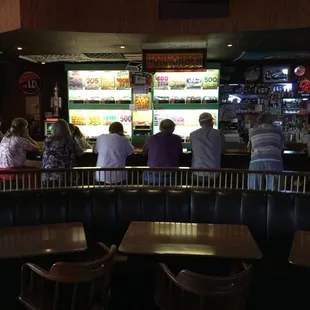 people sitting at the bar