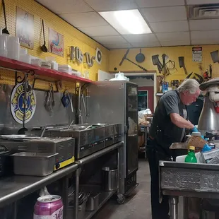 a man preparing food in a kitchen