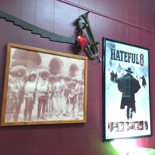 a picture of a man with a sword and a poster of a bandleader