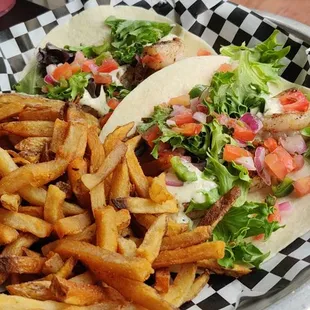 Shrimp tacos and fries