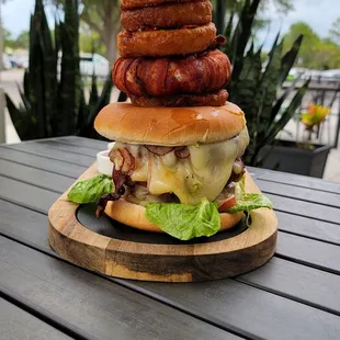 a stack of hamburgers on a table