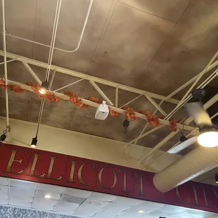 A painted "Ellicott City Sign" mural In between the bar and restaurant area