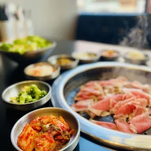 a hot pot with meat and vegetables