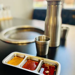 a container of bbq sauce and a container of ketchup