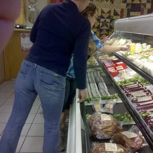 a woman and a child in a grocery store