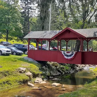 a covered bridge over a creek