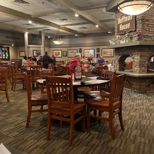 the dining area with a fireplace