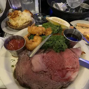 Prime rib with fried prawns and twice baked potato