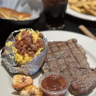 The 8oz Sirloin Steak with grilled shrimp Loaded Baked Potato