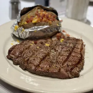 12oz Sirloin Steak, cooked to order. Loaded Baked Potato as side