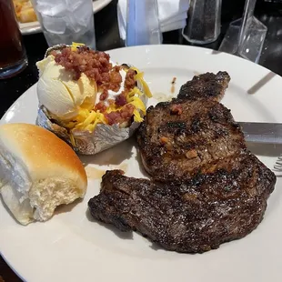 8oz ribeye well done with loaded potato.