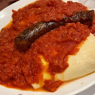 The most amazing Manicott. The lucky sausage got to rest between two hand made pillowy deliciocity