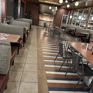 Outside covered patio with fireplace ablaze