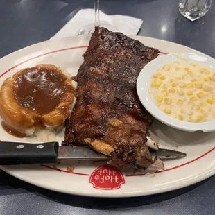 Half rack of ribs, mashed potatoes and creamed corn