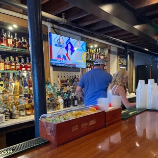 a man and a woman at the bar