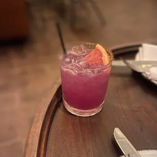 a purple drink on a table