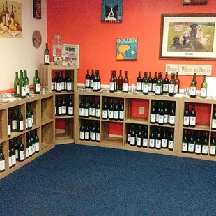 wine bottles on shelves in a wine shop