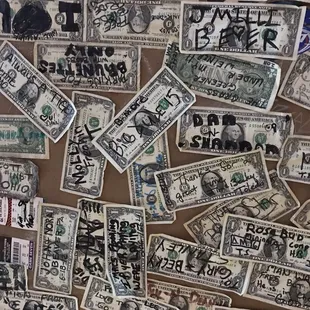 Ceiling above the bar is covered in cash