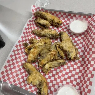 a tray of fried chicken wings on a table