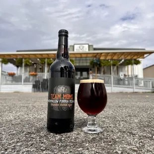 a bottle and a glass of beer