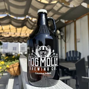 a growl of beer on a table