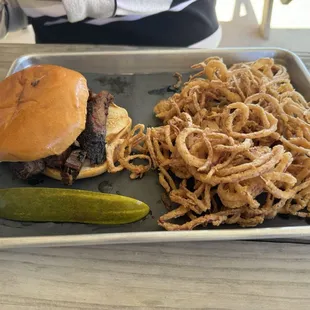 Brisket sandwich and onion straws