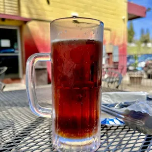 ows a glass of beer on a table